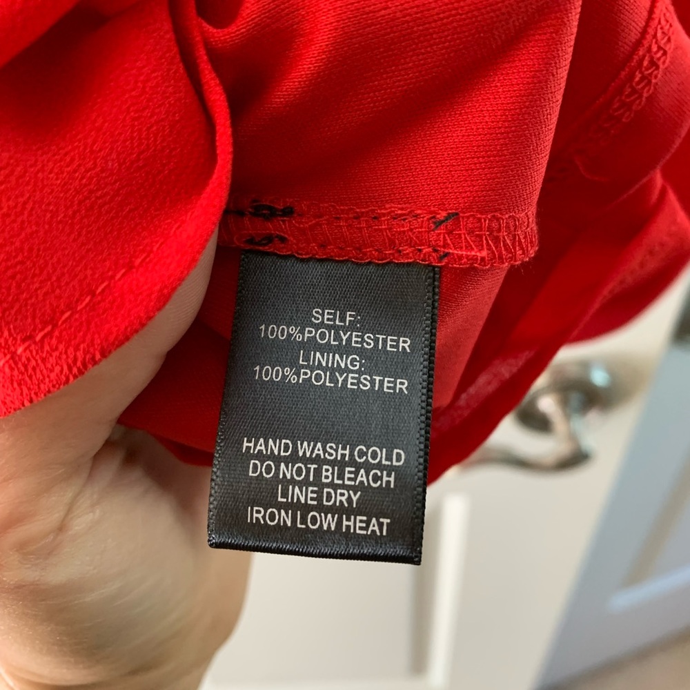 Lulus loose fitting dress, red with 3/4 sleeves with cut. Hits below the knee.